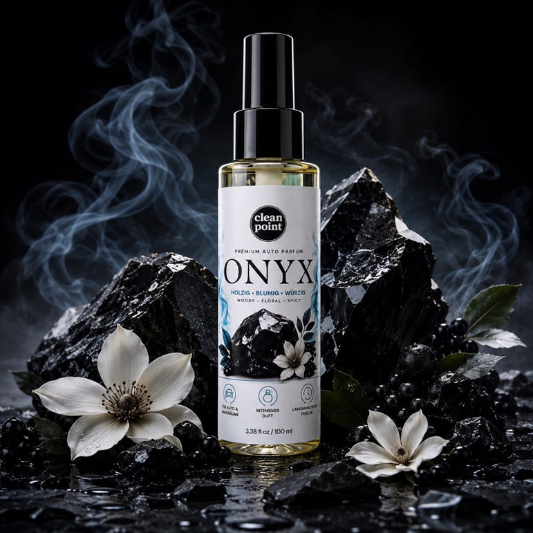 ONYX Premium Auto Parfum mit Onyx-Steinen und weißen Blüten in luxuriöser Produktinszenierung